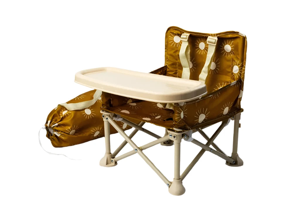 Foldable high chair with brown floral pattern on a marble surface