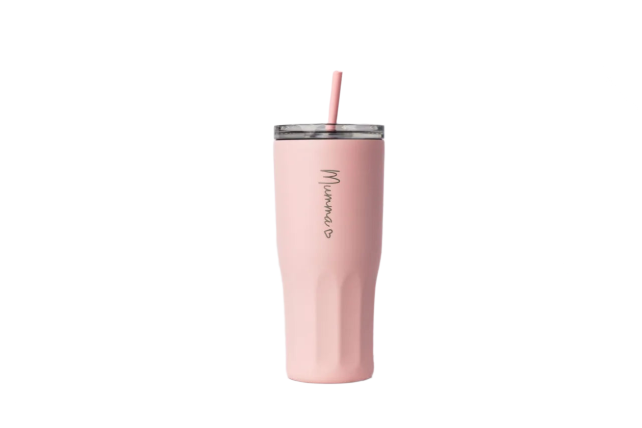 Pink tumbler with straw on a marble surface