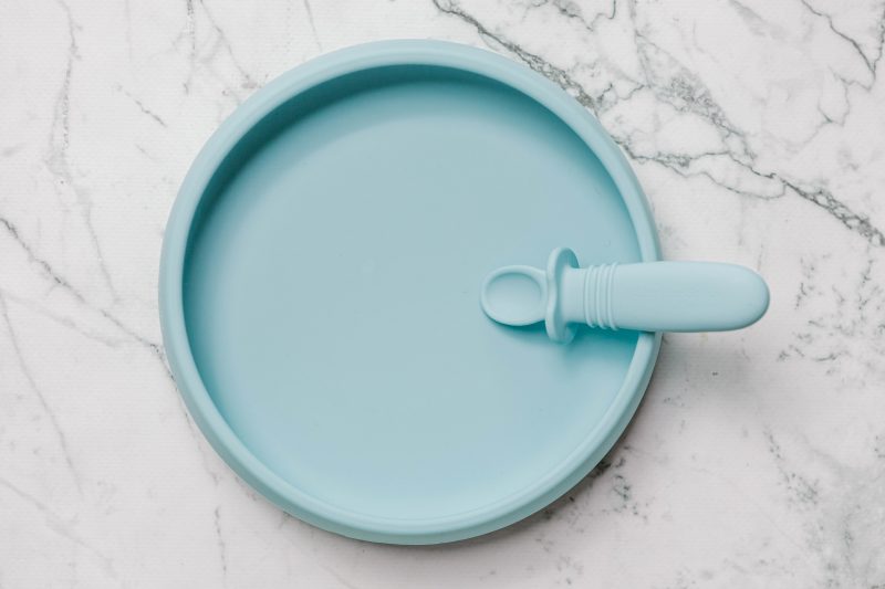 Light blue Suckie Scoop Plate with Selfie Spoon by Starting Solids Australia, on a marble bench.