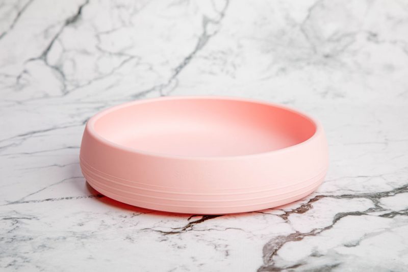 Suckie Scoop Plate by Starting Solids Australia in 'Fairy Floss' pink on a marble bench