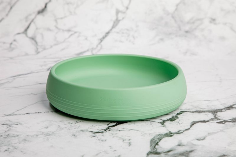 Suckie Scoop Plate by Starting Solids Australia in 'Mint Crisp' green on a marble bench