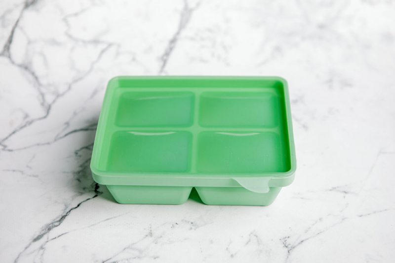 'Mint Crisp' green Freezie Tray for baby food storage by Starting Solids Australia on a marble bench.