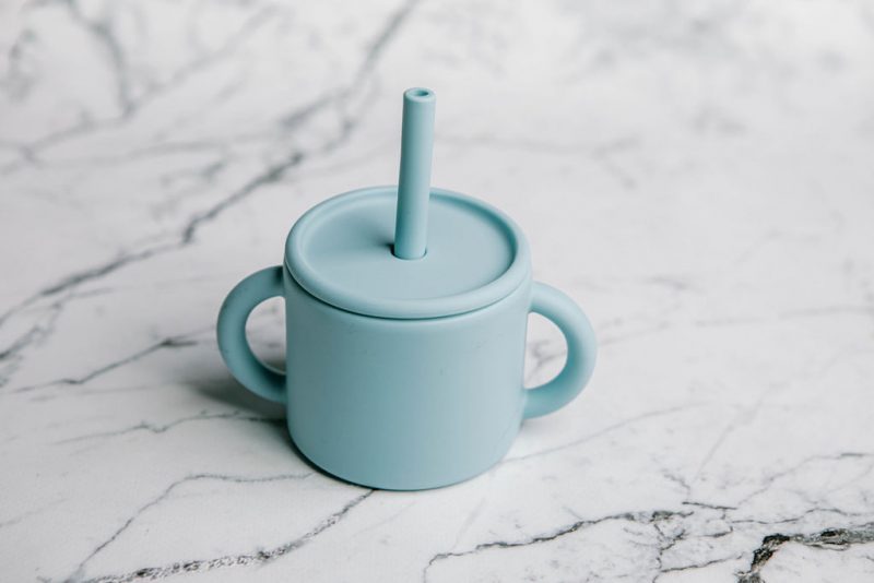 Ideal First Baby Cup in 'Blue Lemonade' colour by Starting Solids Australia, on marble bench.