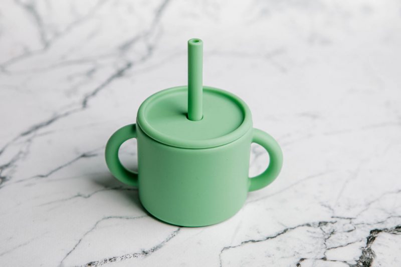 Ideal First Baby Cup in 'Mint Crisp' green by Starting Solids Australia, on marble bench.