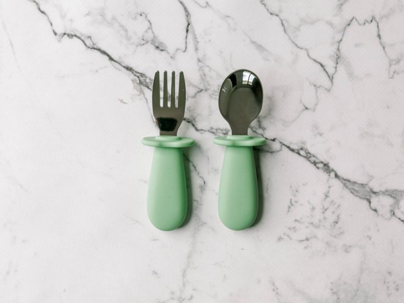 Toddler Silvies (toddler cutlery) in 'Mint Crisp' green by Starting Solids Australia on a marble bench