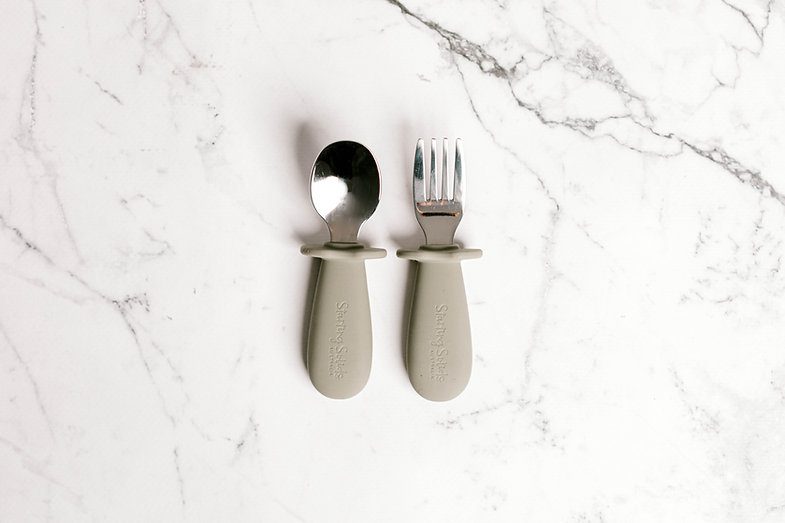 Grey Toddler Silvies (spoon and fork) by Starting Solids Australia on a marble bench.